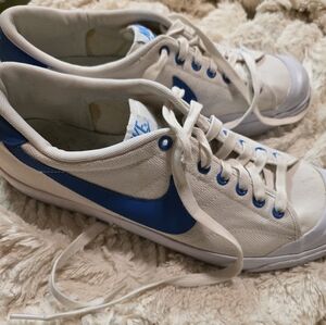 Nike White Canvas Low-Top Sneakers with Blue Swoosh